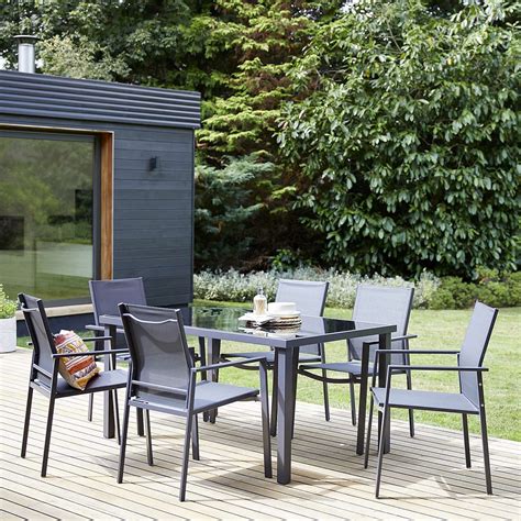 Fashioned from fibreglass and reinforced with resin, this dove grey garden furniture set is incredibly durable and weather resistant. This Dunelm garden furniture has holiday vibes in 2020 | Outdoor dining set, Garden furniture ...