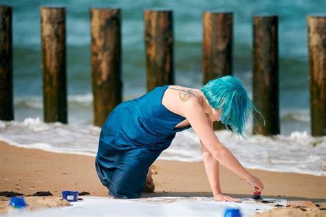 Premium Photo Artistic Blue Haired Woman Performance Artist In Dark Blue Dress Smeared With