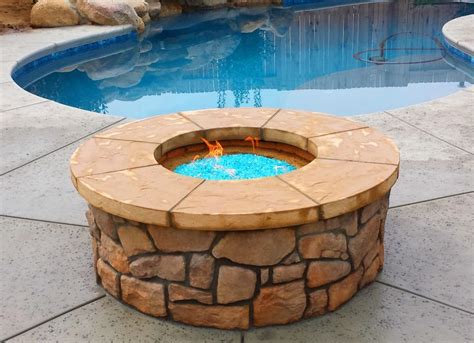 Light Blue Glass Make This Firepit Uniquely Different Fire Features Outdoor Fire Spa Pool