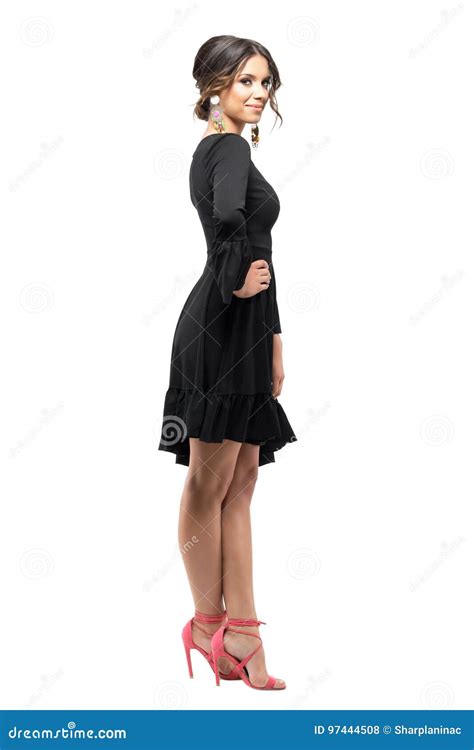 Flirty Sensual Latin Beauty In Black Dress Posing With Hand On Hip