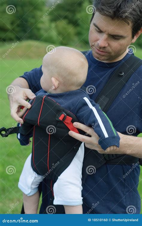 Father Helping Son Into Baby Carrier Stock Photo Image Of Face Close