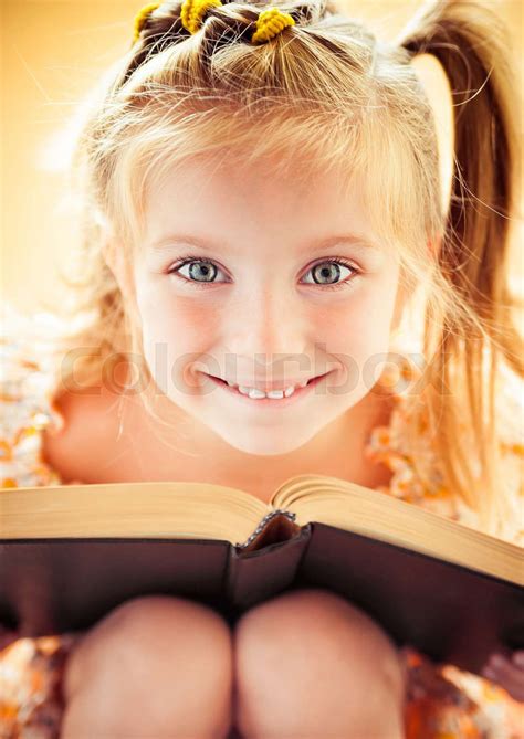Little Girl Reading The Book Stock Image Colourbox