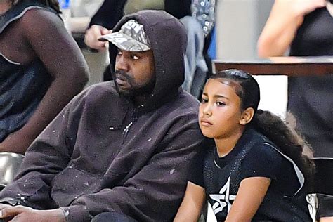 North West Wears Thick Sneakers With Kanye West At Her Basketball Game