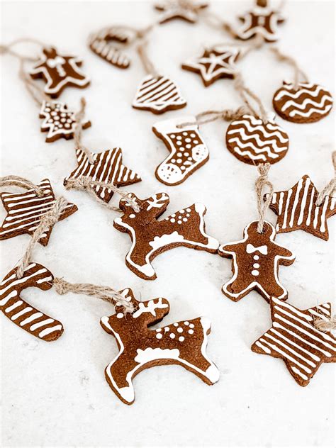 diy iced gingerbread cookie ornaments made with cinnamon dough white and woodgrain