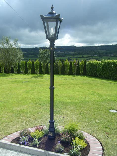 Steel lamp post features a black finish and cross arm. Garden Lighting | Outdoor Lighting & Cast Iron Products, Harte Outdoor Lighting