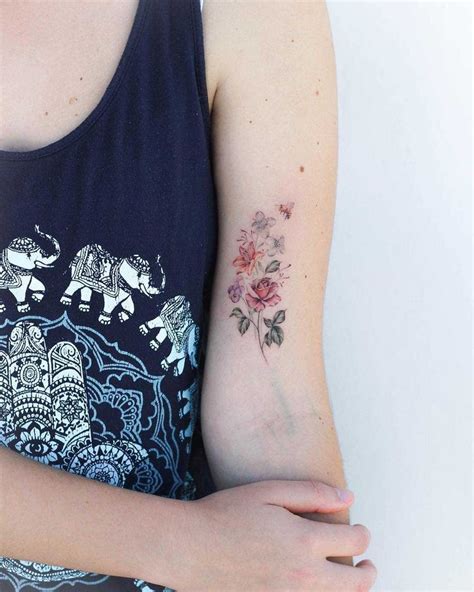 Delicate Flower Bouquet Tattoo Inked On The Left Upper Arm Beautiful Flower Tattoos Bouquet