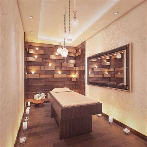 A Spa Room With Wooden Walls And Lights On The Ceiling Along With A Large Bed