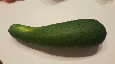 Zucchini is a vegetable shaped a like a cucumber that is longer than it's original and gets considered as summer squash that. First zucchini | Zucchini, Cucumber, Vegetables