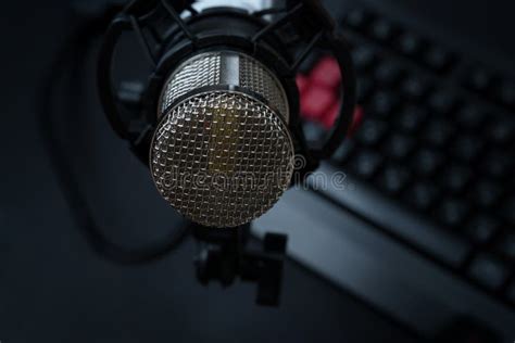 Professional Condenser Studio Microphone Over The Keyboard Stock Photo