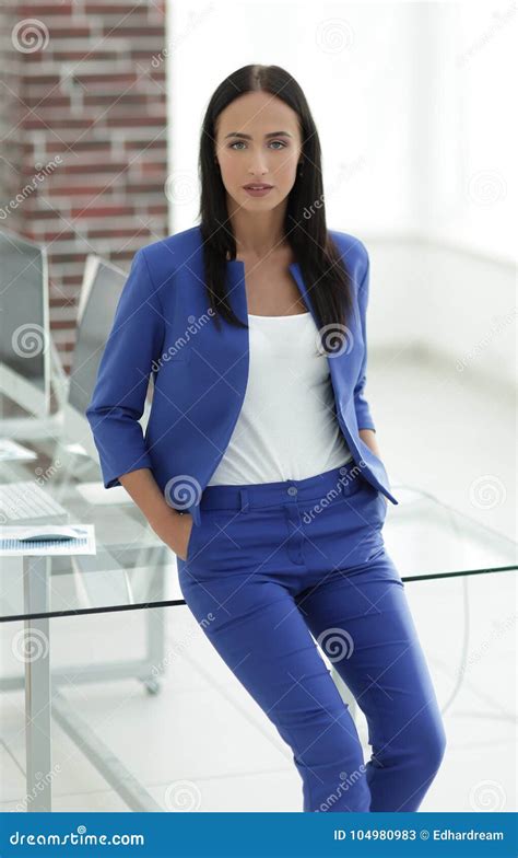 Portrait Of Successful Businesswoman Standing At Her Office Stock
