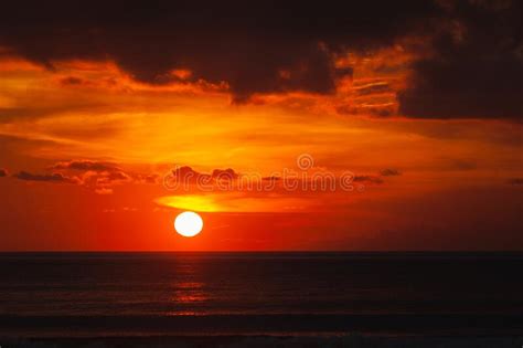 Stunning Dramatic Sunset Over The Ocean Stock Photo Image Of