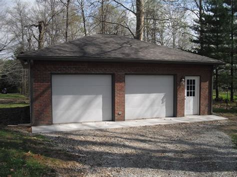 Brick On The Front Of This Two Car Garage Adds Extra Appeal Garage
