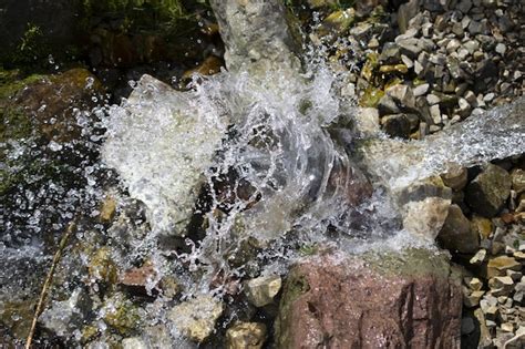 Premium Photo Water Splashing Over Rocks And Rocks In A Stream