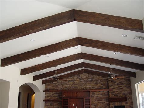 Cut the 2x4 lengths with a circular saw and install them between the joists flush with the bottom of the joist. Exposed Ceiling Beams Ideas - HomesFeed