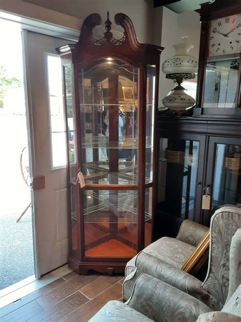 Howard Miller Corner Curio Cabinet Alfreds Consignments