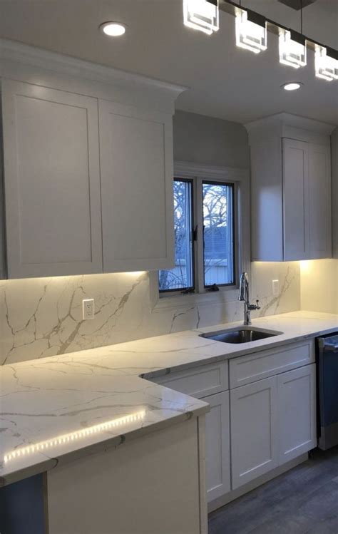 White Shaker Cabinetry With Marble Look Quartz Countertops