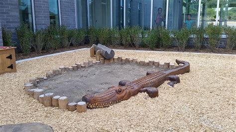 Natural Log Sandbox with Alligator | Natural playground, Nature, Playground