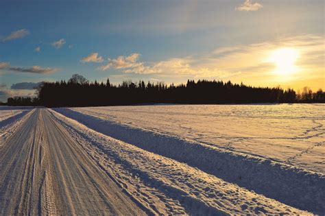 Snow Covered Road During Golden Hour · Free Stock Photo