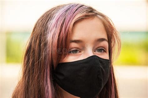 Close Up Of Teenager In An Antiviral Mask Girl In A Protective Mask