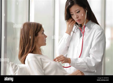 Female Doctor Checking Patient´s Heart With Stethoscope Stock Photo Alamy