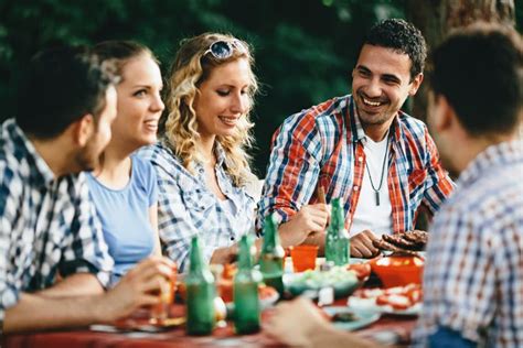 Group Of Happy People Eating Food Outdoors Stock Photo Image Of Enjoy