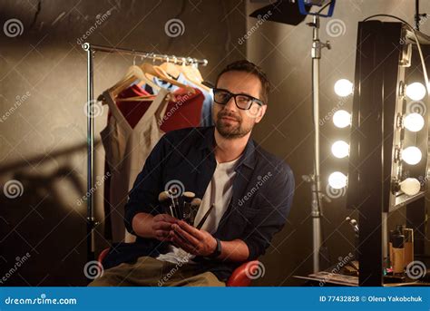 Professional Male Beautician With Equipment Backstage Stock Photo
