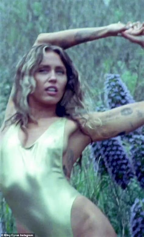 Miley Cyrus Stuns In Revealing Gold Swimsuit And Sends Fans A Mysterious Message