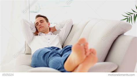 Calm Young Man Sleeping On Couch Stock Video Footage 4505024