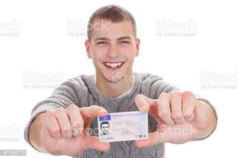 Young Man Showing His Driver License Stock Photo Download Image Now