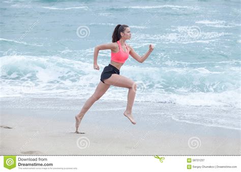 Woman Running On The Beach At Cloudy Morning Side View Stock Image Image Of Jogger Jogging