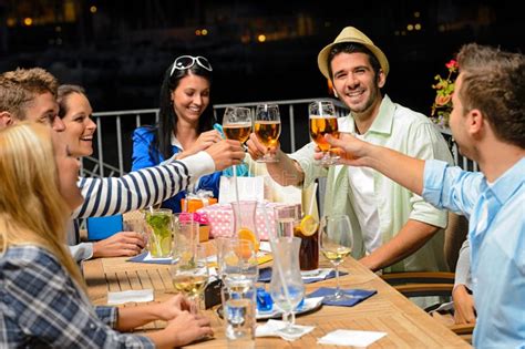 Group Of Young Friends Drinking Beer Outdoors Stock Image Image Of