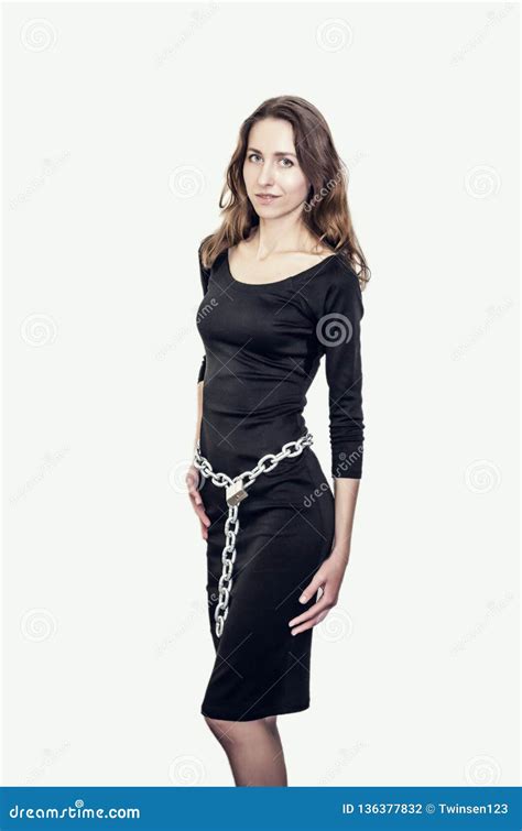 Slim Figure Girl In Black Dress Metal Chains On The Lock Around The