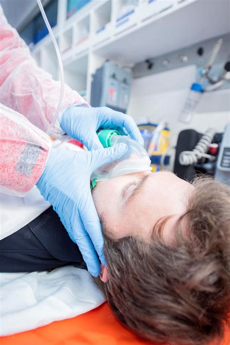 Premium Photo Inside Ambulance Doctor Fastens Mask To Sick Patient On