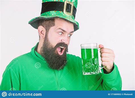 Celebrating Saint Patricks Day In Bar Irish Man With Beard Drinking