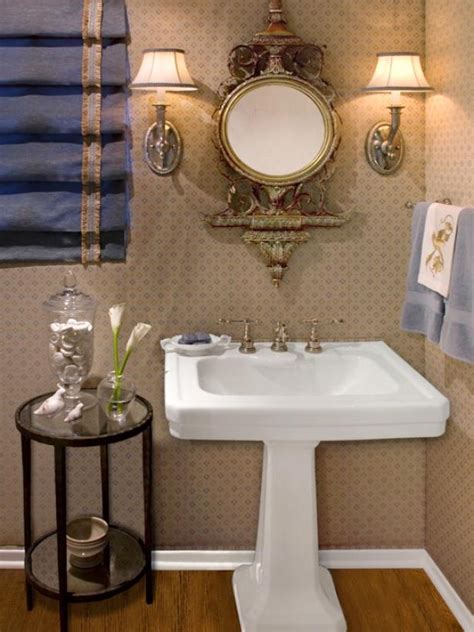 elegant powder room  stunning pedestal sink  ornate mirror hgtv