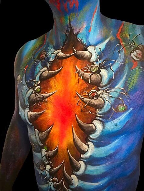 The Back Of A Man S Body Is Painted With Different Colors