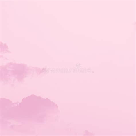 Beautiful White Soft Fluffy Clouds On A Pale Pink Sky Background Stock