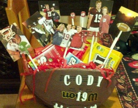 You can actually get the names of your seniors written on the mug and gift it. Football candy bouquet for Senior night | Football gifts ...