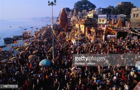every morning hindu pilgrims crowd the bathing ghats that line the western bank of the ganges