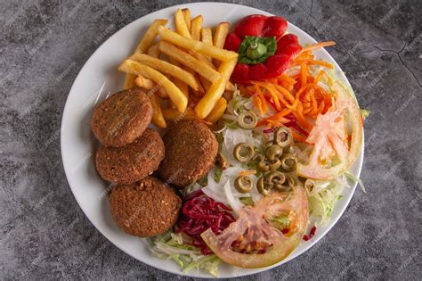 Premium Photo Falafel Platter With Salad And Fries Served At A Fast