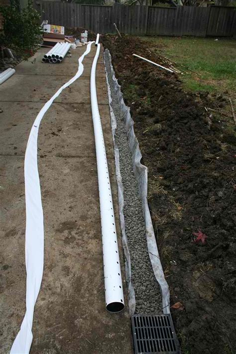 They move the water through hidden pipes to a termination point such as a dry well. How to install Backyard Drainage / French Drain | Marin ...