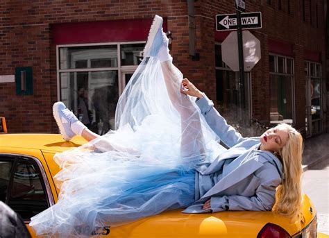 Gigi Hadid Spreads Legs In Blue Tulle Skirt Atop Taxi For New