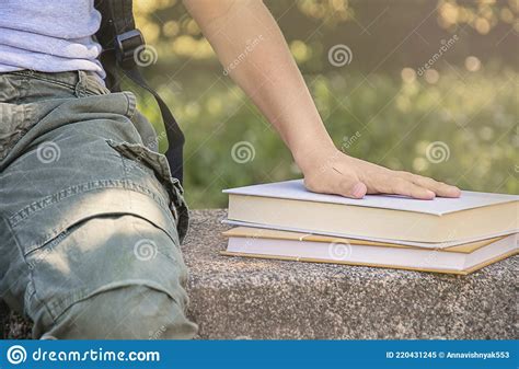The Boyand X27s Hand Is On The Booksclose Upschoolboy Stock Image