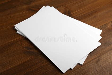 Stack Of Blank Paper Sheets On Wooden Table Brochure Design Stock