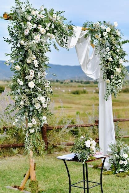 Free Photo Decorated Wedding Arch With Greenery And White Eustomas In