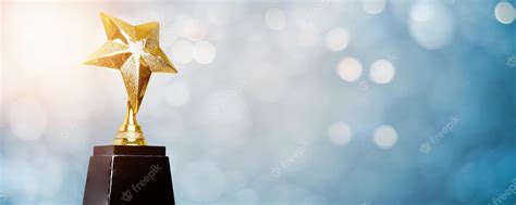 Premium Photo Golden Trophy Award Bokeh Soft Blue Background Winner