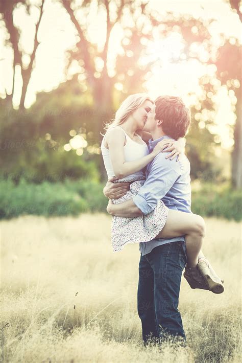 Kissing Couple In Love Outdoor On A Field By Take A Pix Media Couple