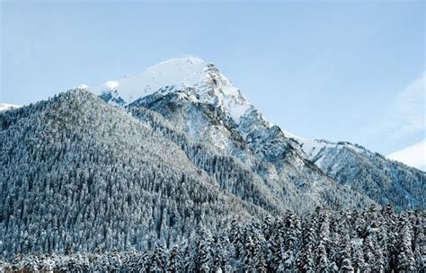 Premium Photo Snow Capped Mountain Peaks