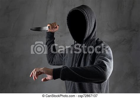 Dangerous Hooded Man Standing In The Dark And Holding A Knife Face Can