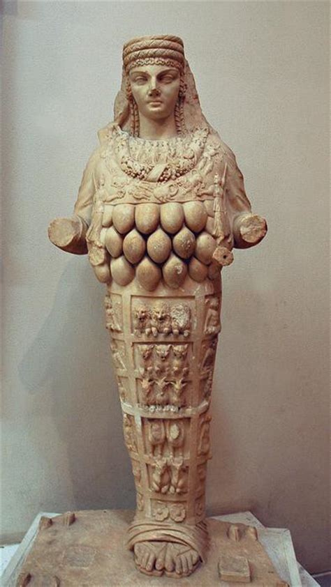 what are these strange breast like objects covering the goddess artemis of ephesus r